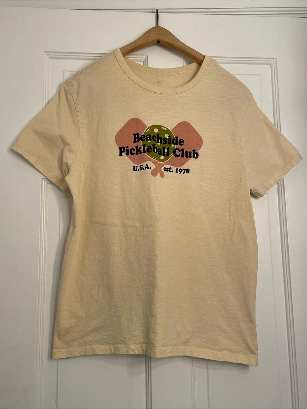 dip Beachside Pickleball Club Graphic Tee - Cream with Coral and Olive
